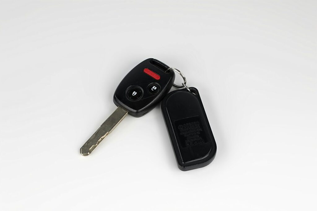 A car key with a remote fob. Illustrative image, not a vehicle compatibility match.